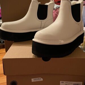 Uggs women’s  size 12 platform boots in white.
